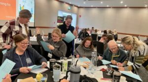 Participants at a table talking.